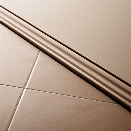 Cream floor and wall tile trim